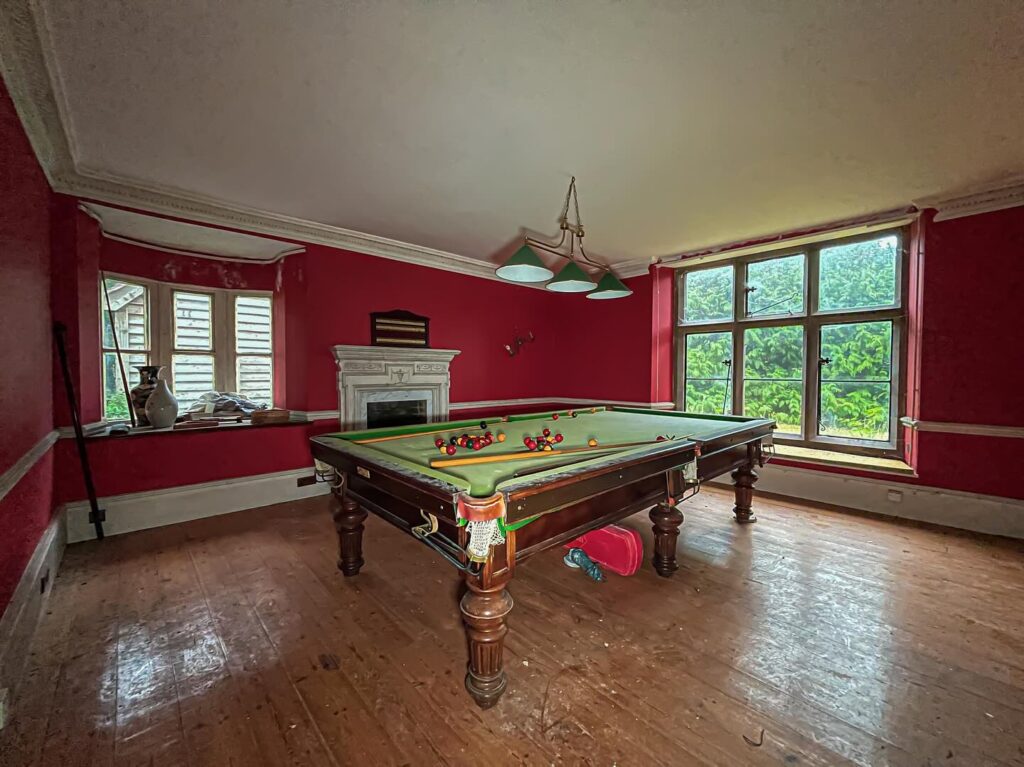 Urban explorer discovers £1.4m abandoned mansion in Gloucester with swimming pool, snooker table - renovation halted mid-project, now decaying deep in overgrown woodland.