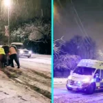 Snow chaos in Nottinghamshire as stranded drivers push cars up an icy hill, while vehicles skid, stall and even an ambulance struggles to climb the slippery slope.
