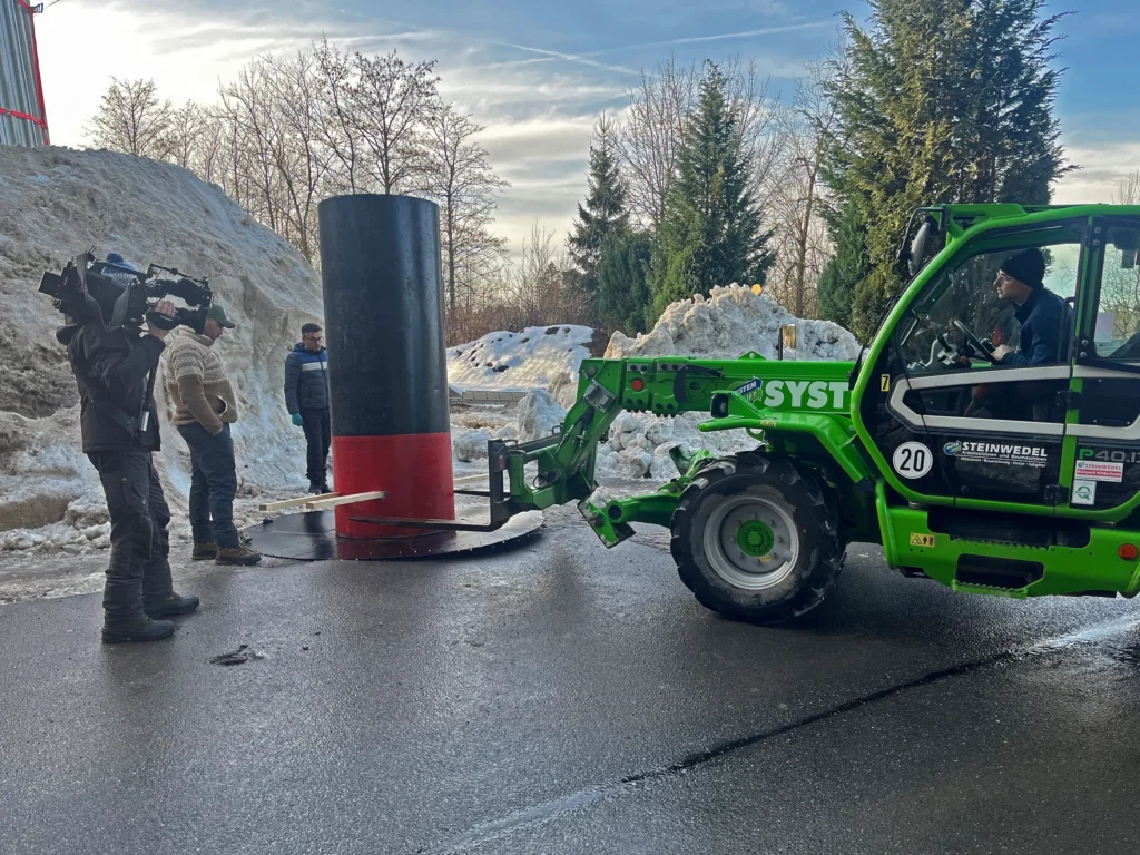 Couple builds Lars the Great, a 100-ton 38ft snowman at German mountain campsite with help from 30 volunteers. The giant features hand-crocheted scarf.