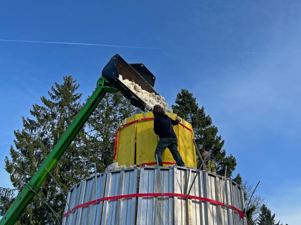 Couple builds Lars the Great, a 100-ton 38ft snowman at German mountain campsite with help from 30 volunteers. The giant features hand-crocheted scarf.