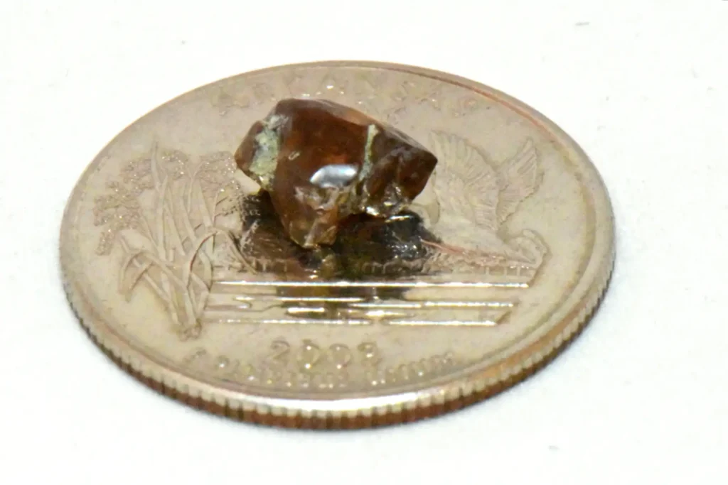 Dad finds 2-carat brown diamond worth £12,000 while mining with son at Arkansas state park - family nearly went home but kids insisted on staying second day.