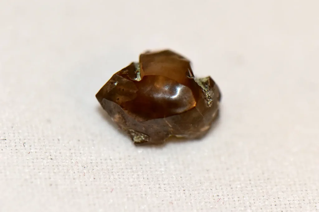 Dad finds 2-carat brown diamond worth £12,000 while mining with son at Arkansas state park - family nearly went home but kids insisted on staying second day.