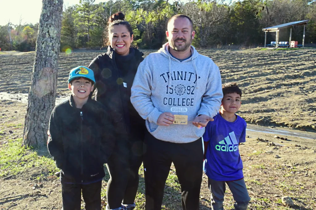 Dad finds 2-carat brown diamond worth £12,000 while mining with son at Arkansas state park - family nearly went home but kids insisted on staying second day.