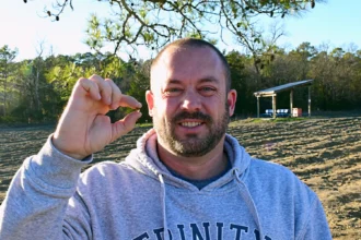 Dad finds 2-carat brown diamond worth £12,000 while mining with son at Arkansas state park - family nearly went home but kids insisted on staying second day.