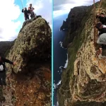 Daredevils edge down a sheer Tenerife cliff using towering wooden poles and no safety gear, filming a vertigo-inducing descent that left viewers dizzy and queasy