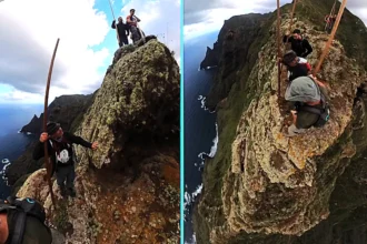 Daredevils edge down a sheer Tenerife cliff using towering wooden poles and no safety gear, filming a vertigo-inducing descent that left viewers dizzy and queasy