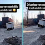Driverless RoboVan bounces on potholed icy road nearly toppling over as onlookers laugh. Autonomous delivery van slams brakes repeatedly on unmade Chinese street.