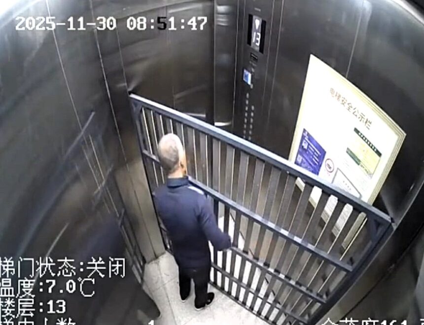 CCTV captures an elderly man stuck in a lift with a bulky bed frame, trapped for 14 minutes as doors jam shut in a slapstick mishap that sent viewers laughing online now
