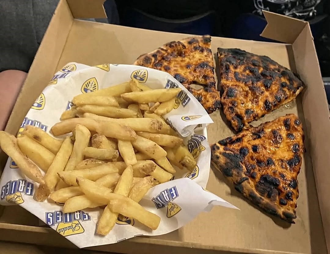 Leeds United charges £9 for burned pizza and chips at Elland Road. Fan shares disappointing 10-inch stone-baked pizza and pale fries from Man Utd match.