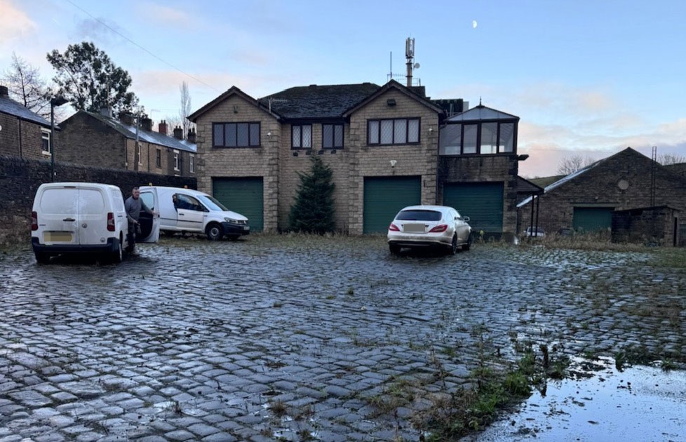 Couple buy derelict house on industrial estate for £330,000 and transform it into dream home with sauna, hidden playroom and space for 50 cars in Derbyshire.