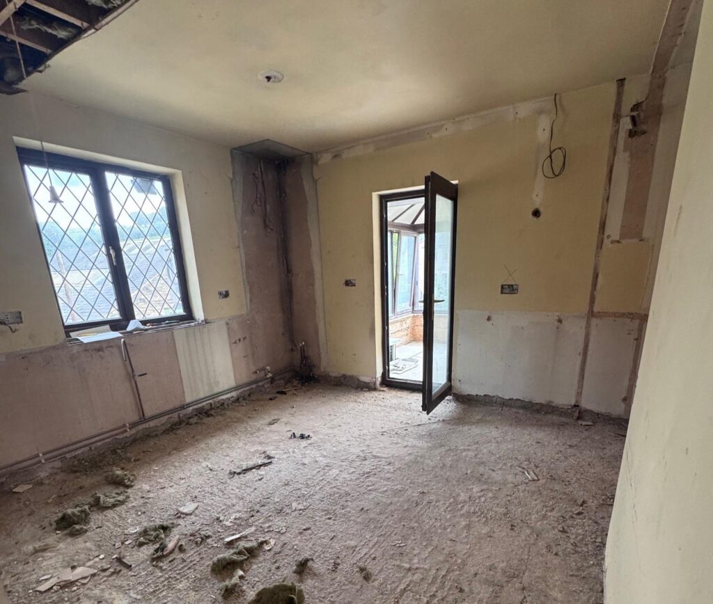 Couple buy derelict house on industrial estate for £330,000 and transform it into dream home with sauna, hidden playroom and space for 50 cars in Derbyshire.