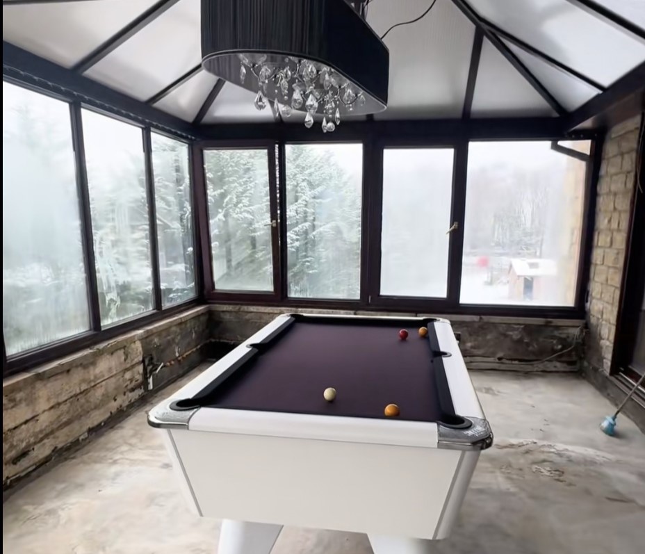 Couple buy derelict house on industrial estate for £330,000 and transform it into dream home with sauna, hidden playroom and space for 50 cars in Derbyshire.