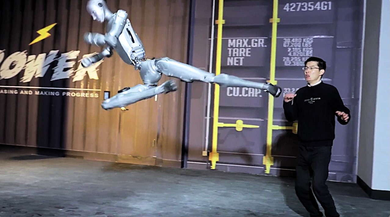 Fighting robot H2 humanoid launches impressive martial arts kicks and breaks watermelons - 5'9" Chinese robot trains with humans in viral video with 5 million views.