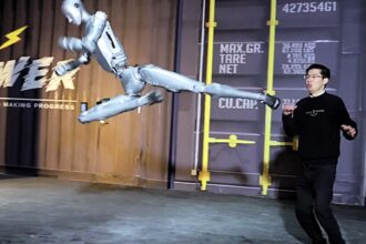 Fighting robot H2 humanoid launches impressive martial arts kicks and breaks watermelons - 5'9" Chinese robot trains with humans in viral video with 5 million views.