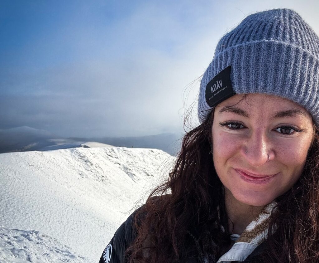 Fearless wild swimmer smashes through a frozen Welsh mountain lake for a sub zero dip, chasing dopamine highs and adrenaline as winter swim season officially begins
