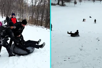 Police officer launched down snowy hill in rubber ring goes viral after hitting bump and crashing onto his back - 89,000 likes as viewers joke about service weapon.