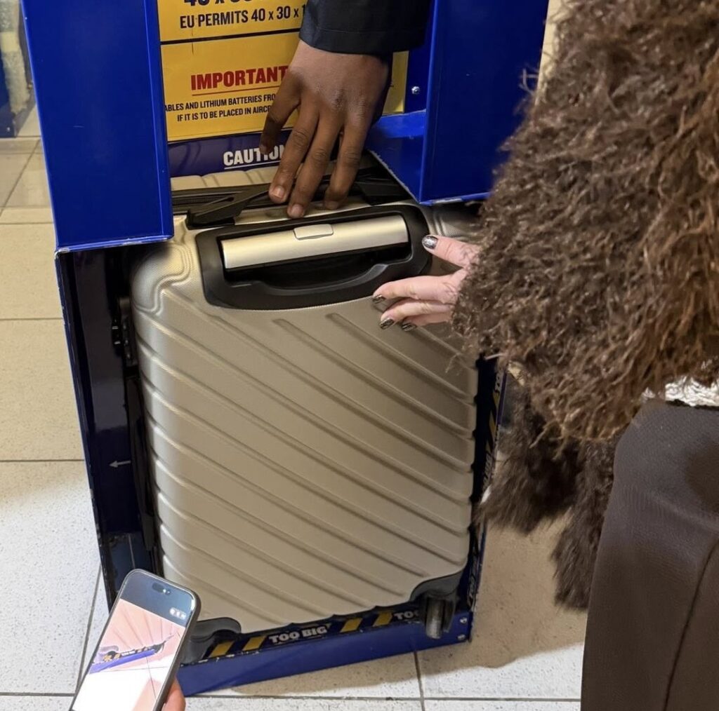 Ryanair passenger claims she was hit with a £75 fine at the gate because her suitcase wheels poked out of the bag sizer, despite paying extra for priority cabin baggage.
