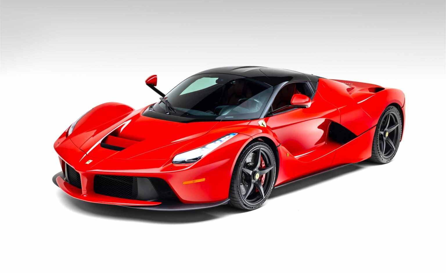 A celebrity loved Ferrari LaFerrari with under 2,000 miles is heading to auction at £3.6m, boasting Rosso Corsa styling, elite ownership history and hypercar rarity.