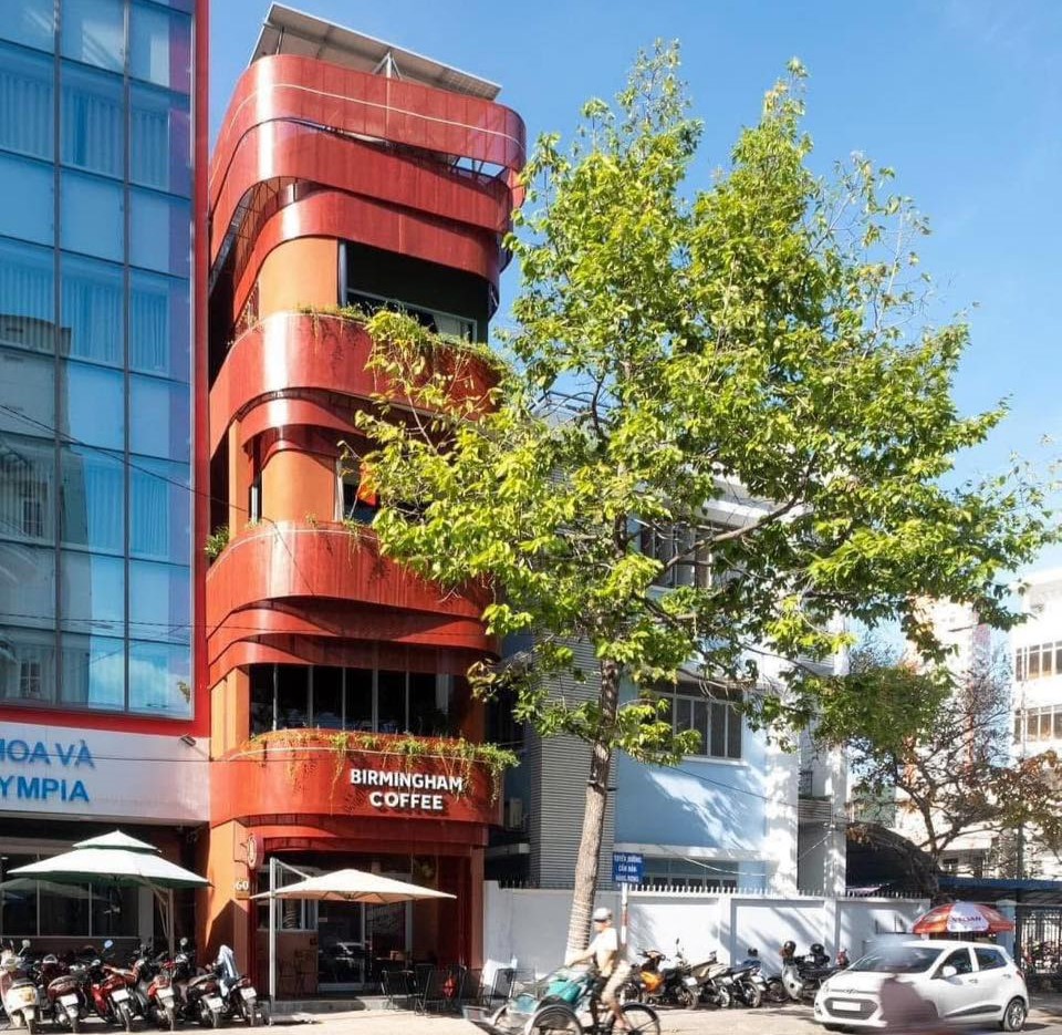 British backpackers discover Birmingham Coffee cafe in Nha Trang, Vietnam, 6,000 miles away, featuring Peaky Blinders art and Bull Ring pictures with cheap lattes.