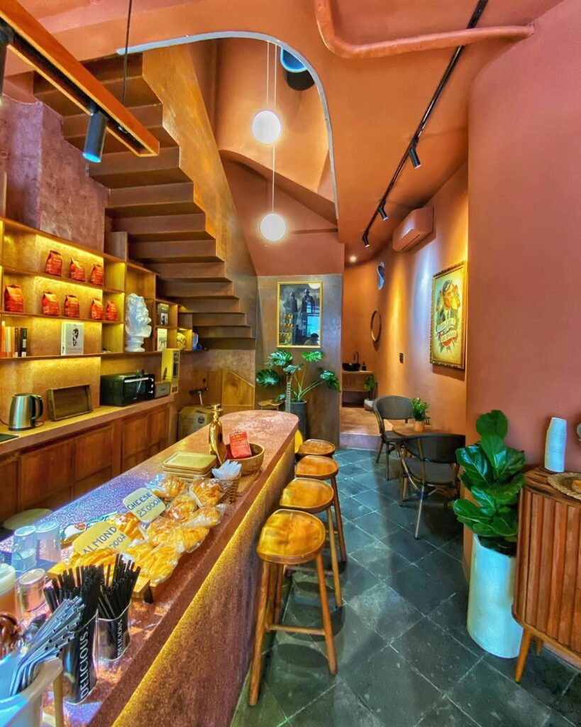 British backpackers discover Birmingham Coffee cafe in Nha Trang, Vietnam, 6,000 miles away, featuring Peaky Blinders art and Bull Ring pictures with cheap lattes.