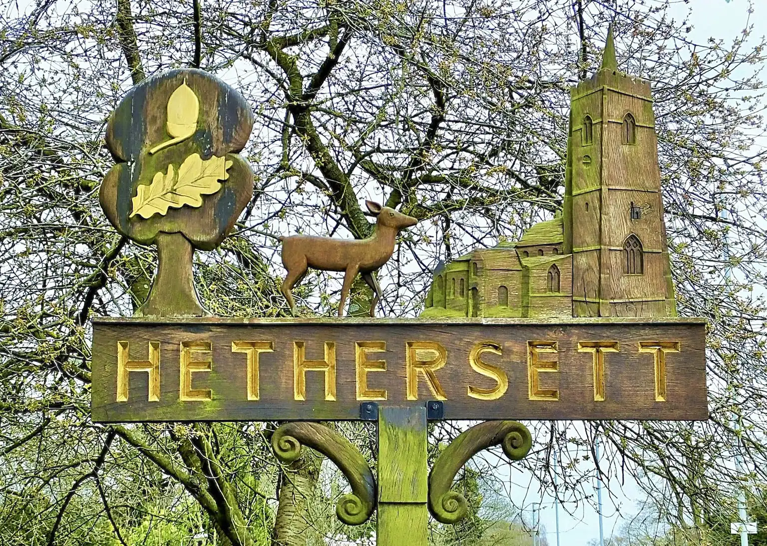 Lorry driver spends six weeks hand-restoring 50-year-old Hethersett village sign near Norwich. Self-taught Craig Jenkins saved the rotten oak carving for locals.