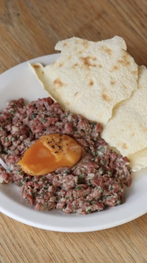 Gordon Ramsay slammed for serving £14 raw steak tartare at Pizza East Shoreditch that fans say looks like dog food, with some joking about salmonella risks on the French dish.