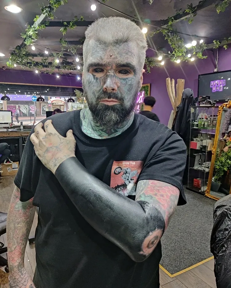 Britain's most tattooed man King of Ink Land celebrates four years without new ink after giving up tattoos to pay off his mortgage, with just £5,000 remaining on his Birmingham home.