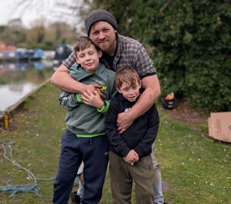 Single dad of three reveals how ditching a house for life on a narrowboat cut costs, healed grief, and gave his boys an adventurous childhood afloat