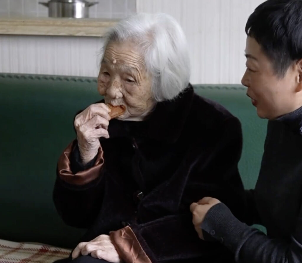 101-year-old night owl stays up until 2am watching TV and eating crisps, claiming it's her secret to longevity. Chinese woman still has full set of teeth and wakes at 10am.