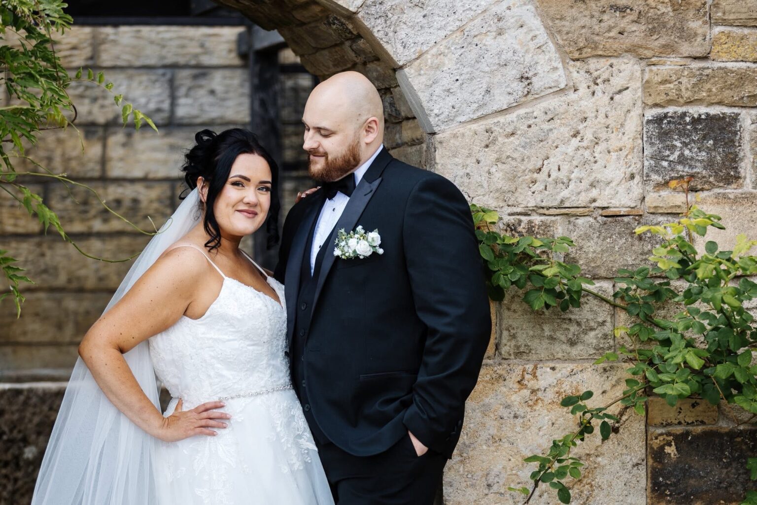 A savvy bride saved £6,000 on her dream black-and-white wedding by ditching pricey suppliers and turning to Temu - even DIYing her own flower arch for £300 instead of paying £800.