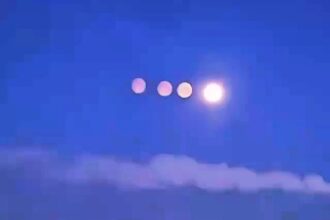 Rare paraselene phenomenon created quadruple moon illusion over St Petersburg, Russia. Ice crystals in frosty atmosphere bent light to produce stunning display.