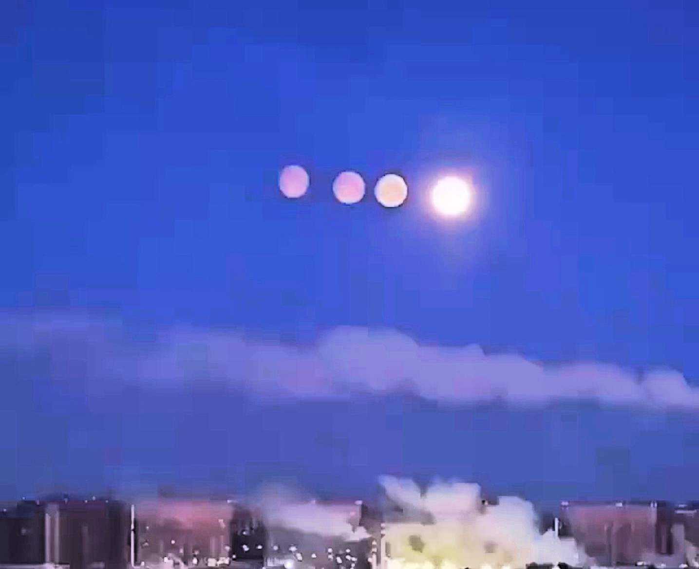 Rare paraselene phenomenon created quadruple moon illusion over St Petersburg, Russia. Ice crystals in frosty atmosphere bent light to produce stunning display.