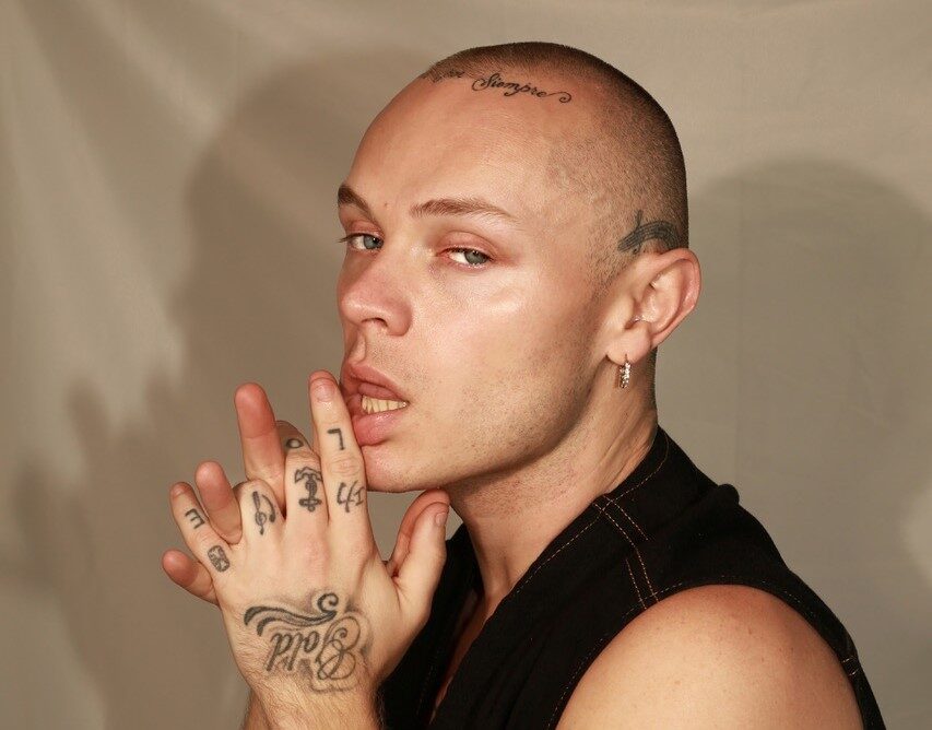 Heartbroken singer Dan Devlin stunned commuters by eating a bouquet of roses at Embankment Tube station, a viral stunt to promote his new single Someone Else