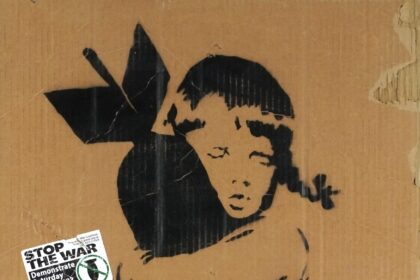 Early Banksy anti Iraq War placards Bomb Hugger and Yellow Chopper have sold for £1,800 each, rare relics from the 2003 London protest march.