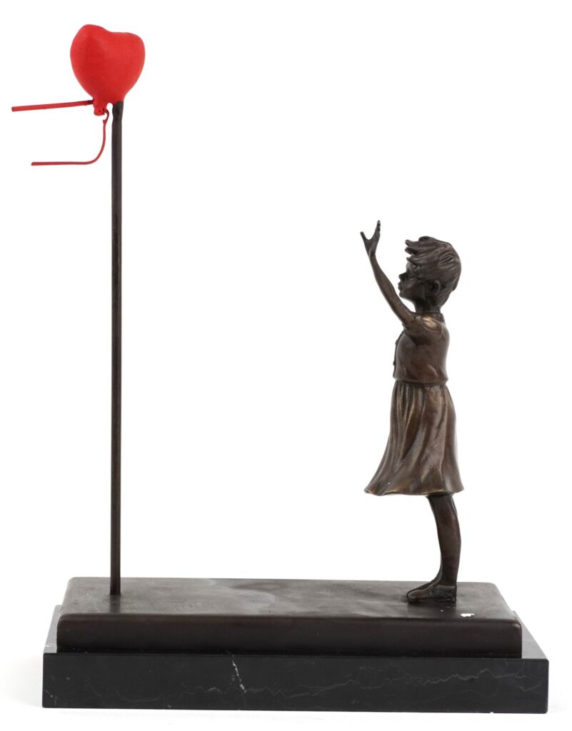 Early Banksy anti Iraq War placards Bomb Hugger and Yellow Chopper have sold for £1,800 each, rare relics from the 2003 London protest march.