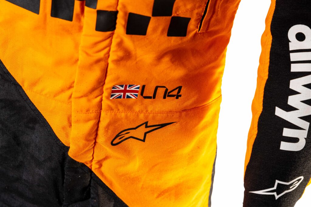 A signed Ferrari racing suit worn by Michael Schumacher at his 2006 Italian Grand Prix win has sold for nearly £100,000, smashing estimates at auction.