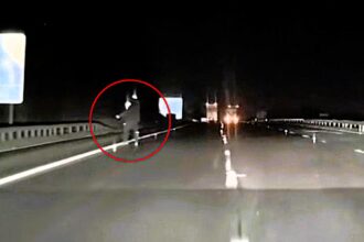 Singer Lauren Amour captures spooky Slenderman-like figure on dashcam while driving A69 at 2am. Tall being with glowing head moved towards her car. Over 240,000 views.