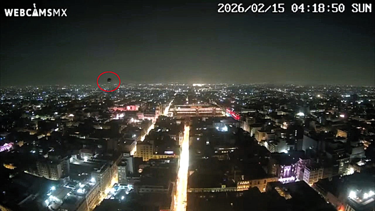 A city webcam filmed a mysterious spherical object gliding over Mexico City at 4:18am, sparking UFO theories online as officials stay silent on the viral sighting