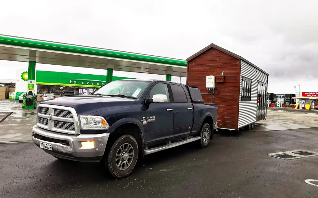 Woman saves £70,000 on bills living in 194 sq ft tiny home for 9 years in New Zealand. Features composting toilet and million-dollar view. Says she made right choice.