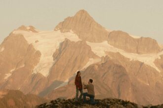 Junebug Weddings reveals 2026’s best engagement photos, with couples embracing cinematic backdrops from misty mountains to Lake Como for unforgettable romantic scenes