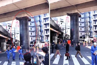 Commuters were left shocked when a huge 32ft steel pipe burst through a road from an underground construction site in Osaka, Japan - leaving a large crater in the street.