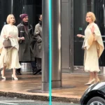 Angelina Jolie spotted strutting through Canary Wharf in a white gown and blonde bob - leaving Londoners stunned while filming her new comedy movie Anxious People.