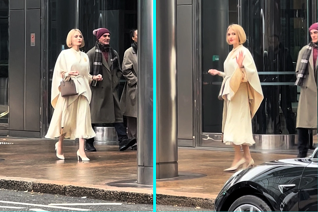 Angelina Jolie spotted strutting through Canary Wharf in a white gown and blonde bob - leaving Londoners stunned while filming her new comedy movie Anxious People.