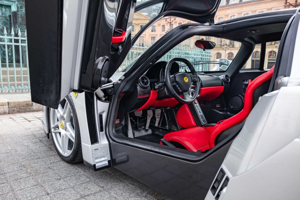 An ultra-rare Ferrari Enzo in a unique silver finish heads to market for €5.3m, with low mileage, full history and elite collector appeal driving intense interest