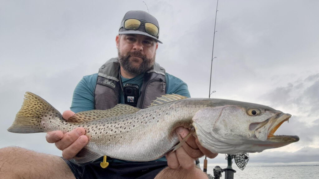 A stunned fisherman claims he spotted an alien UFO hovering above a Florida motorway - pulling out his phone to film the glowing object sparking debate online about SpaceX.