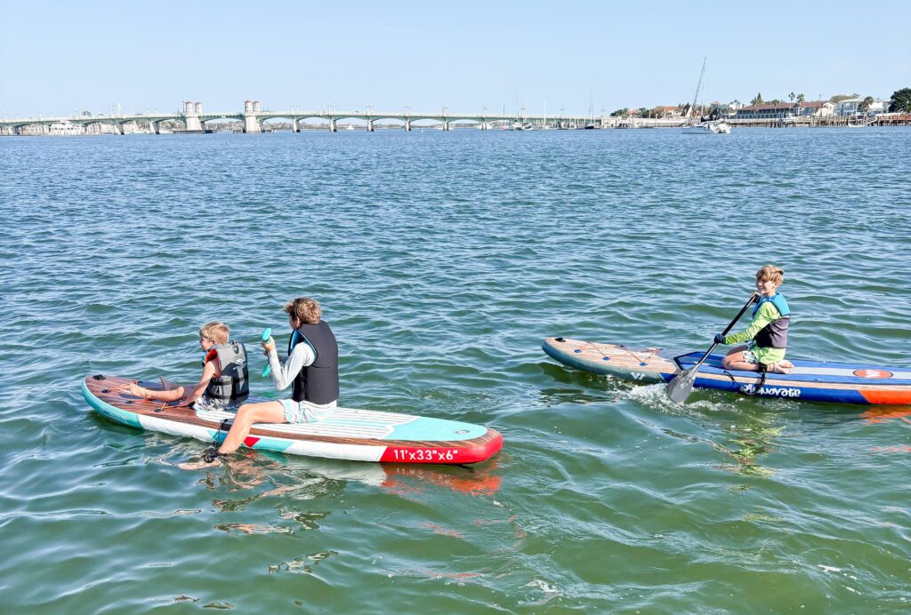 A couple sell their home to live on a catamaran with four kids, cutting bills by 75% while embracing a simpler life filled with travel, challenges and adventure.