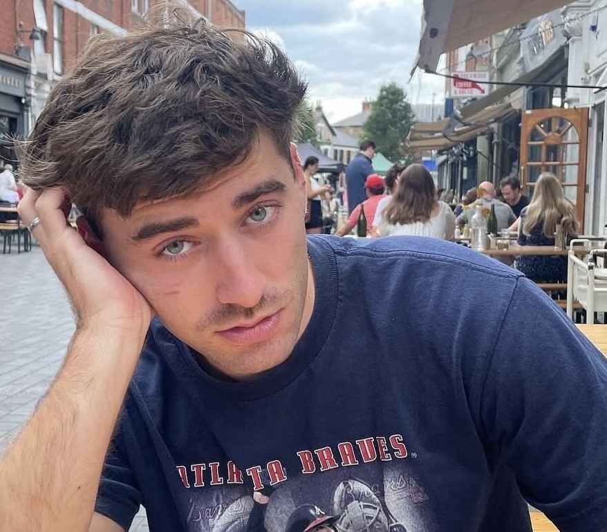 Influencer Carmie Sellitto slammed for flying nine hours while vomiting from food poisoning - he refused to miss his £800 flight and spent an hour being sick in the toilet.