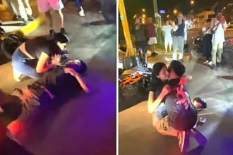 Prankster stages fake motorbike crash to propose to his girlfriend in Lima, Peru - she rushed over in tears before he dropped to one knee and pulled out a ring. She said yes.