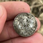 Two metal detector hobbyists have stumbled upon a record-breaking hoard of nearly 3,000 Anglo-Saxon and Viking silver coins in a field in eastern Norway.