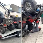 A worker cheats injury after a quad bike flips in a freak accident, performing a somersault while seated before walking away unharmed as stunned colleagues watch.